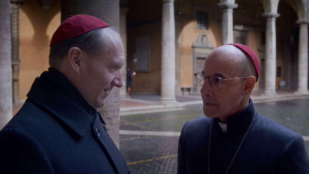 Ralph Fiennes as Cardinal Lawrence and Stanley Tucci as Cardinal Bellini in director Edward Berger's "Conclave." The recent death of Pope Francis has ignited interest the film.