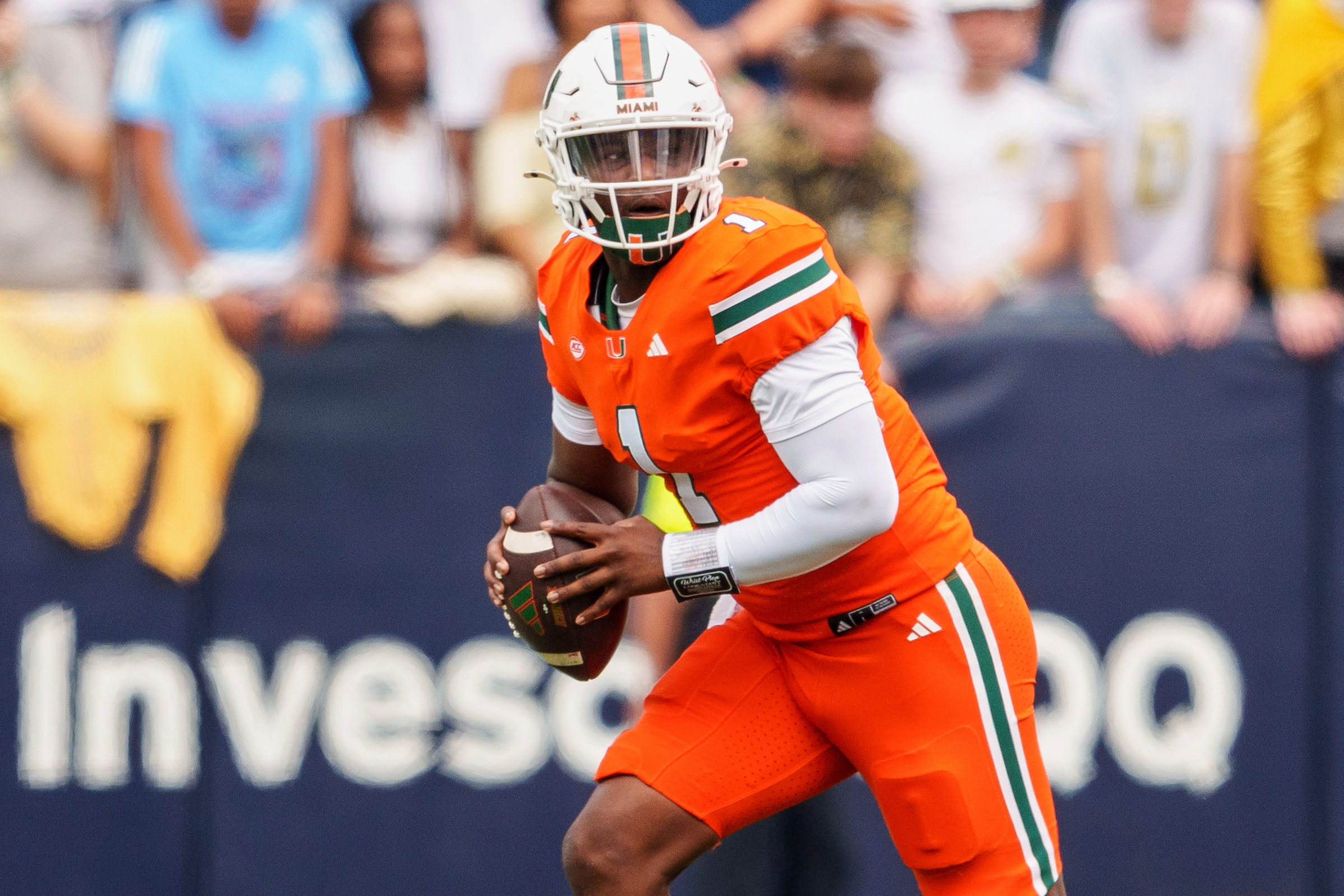 FILE - Miami quarterback Cam Ward (1) looks for an open receiver during the first half of an NCAA college football game against Georgia Tech, Saturday, Nov. 9, 2024, in Atlanta.