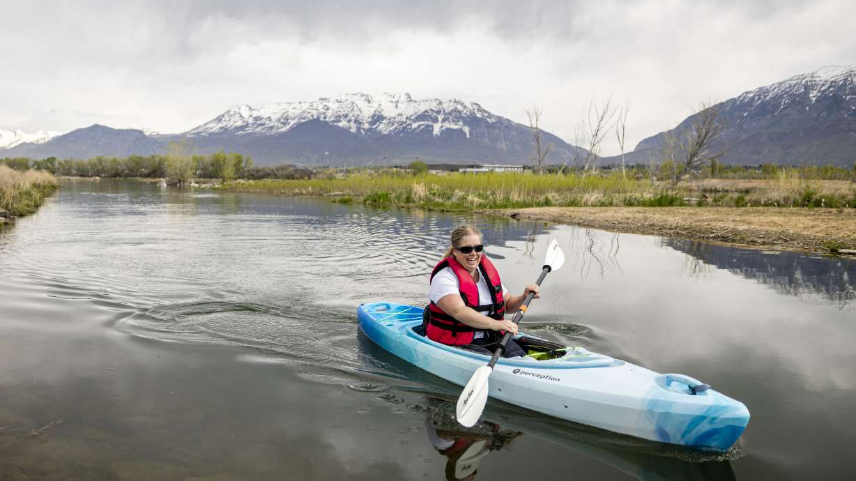 Amalie Simper, of Provo, kayaks on the Provo River Delta near the Skipper Bay Trailhead and Utah Lake in Provo on Wednesday. The Utah Lake Authority is increasing efforts to improve the public perception of Utah Lake.