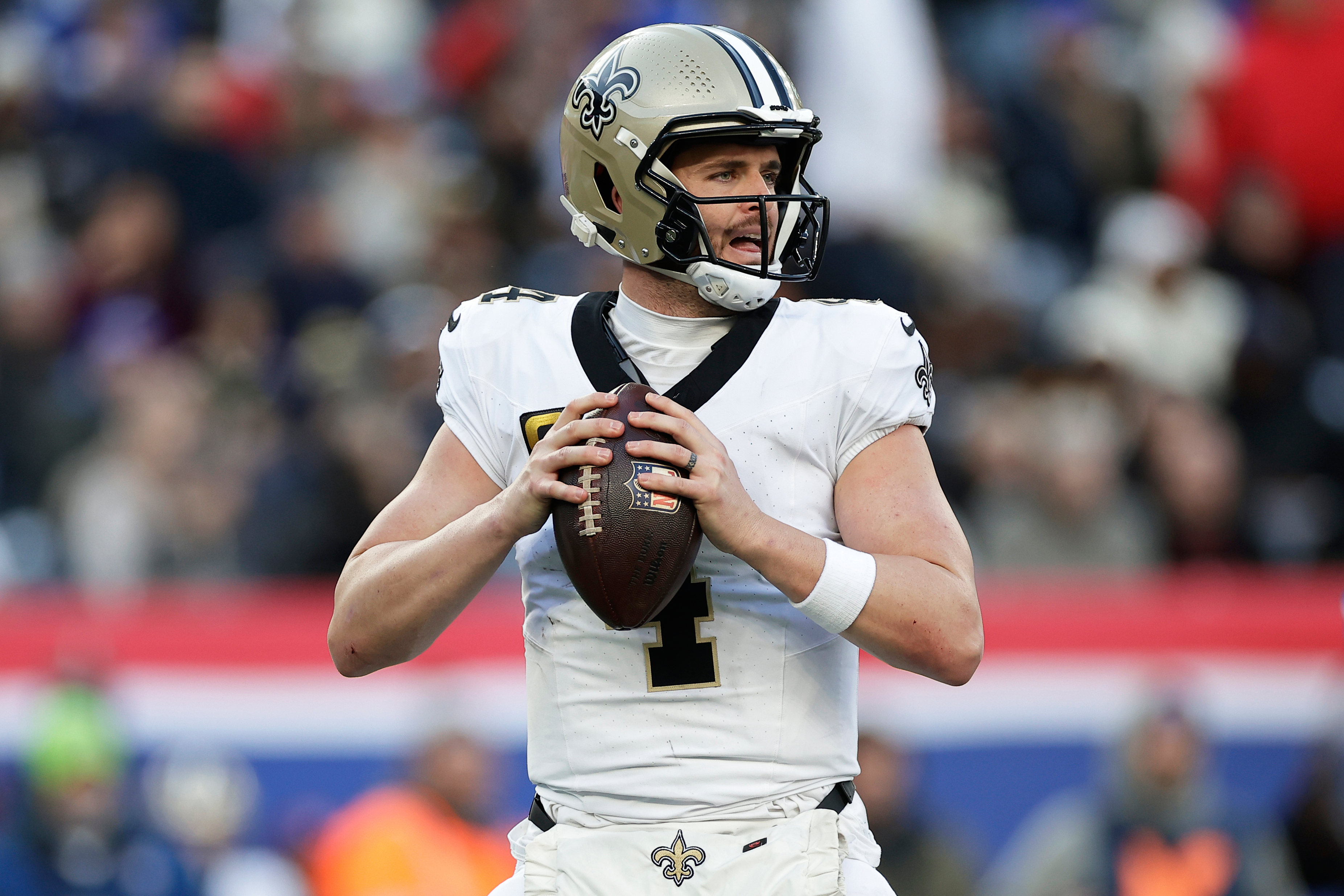 FILE - New Orleans Saints quarterback Derek Carr (4) looks to pass the ball during an NFL football game against the New York Giants, Dec. 8, 2024, in East Rutherford, N.J.