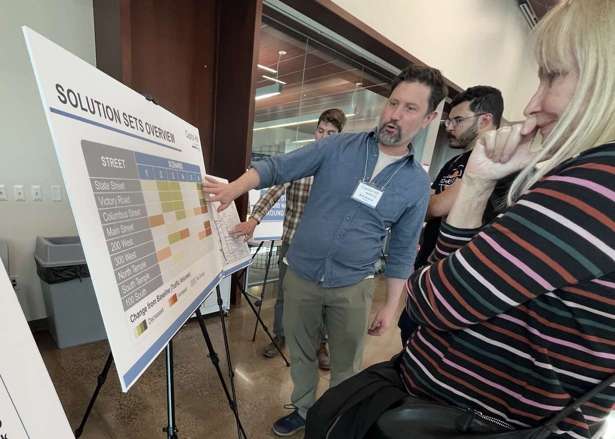 Matt Seipold, a transportation and transit planner for Horrocks Engineers, explains traffic volume proposals to residents at a Capitol Hill Study open house in Salt Lake City on Tuesday.
