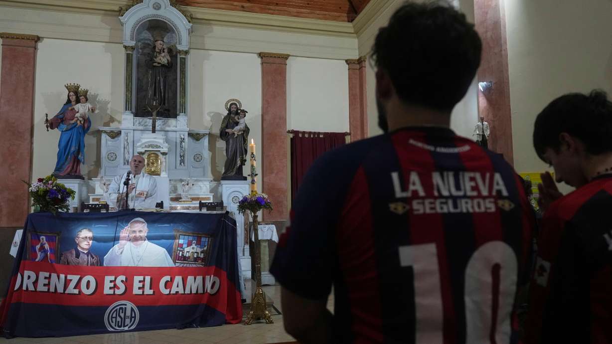 Fans of San Lorenzo soccer club attend a Mass at San Antonio Parish in honor of the late Pope Francis, a lifelong supporter of the club, in Buenos Aires, Argentina, Wednesday, April 23, 2025.