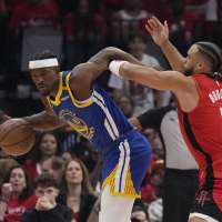 Golden State's Jimmy Butler leaves game with pelvis contusion and his status for Game 3 is unknown
