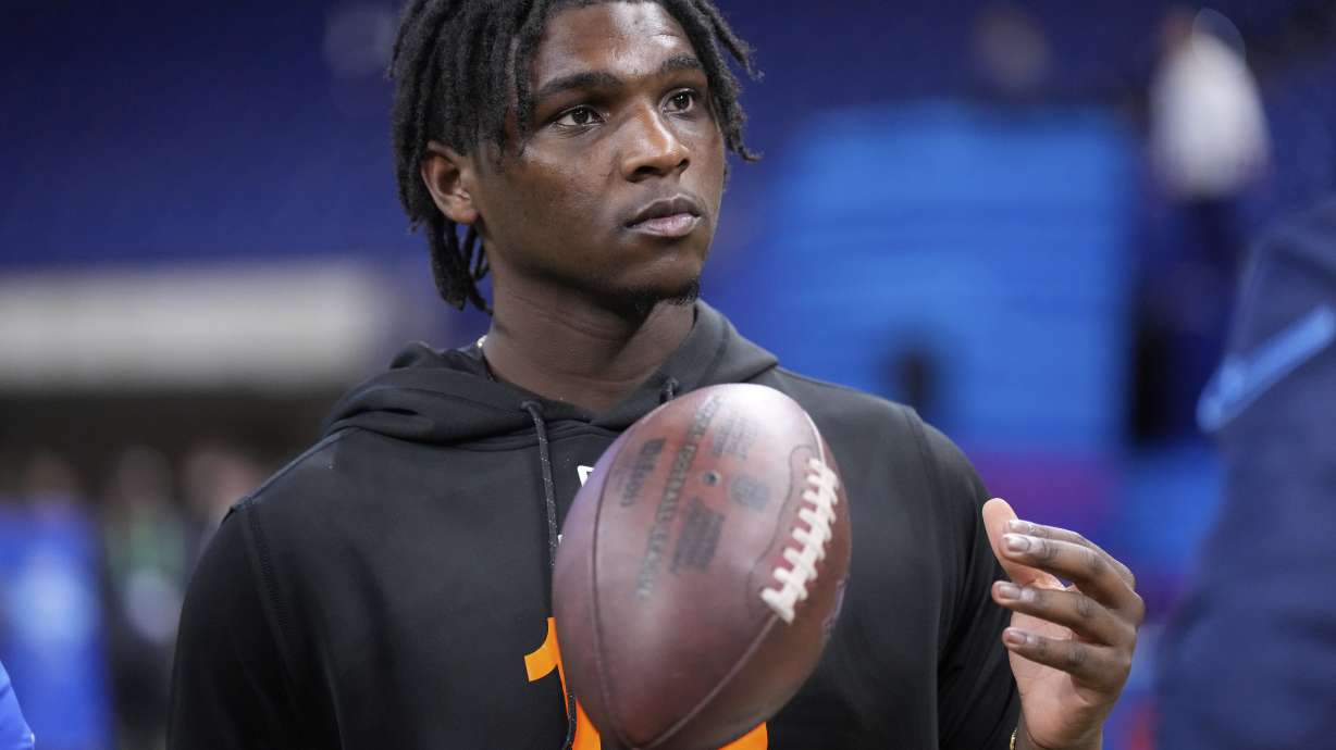 FILE - Miami quarterback Cam Ward watches a drill at the NFL football scouting combine in Indianapolis, Saturday, March 1, 2025.