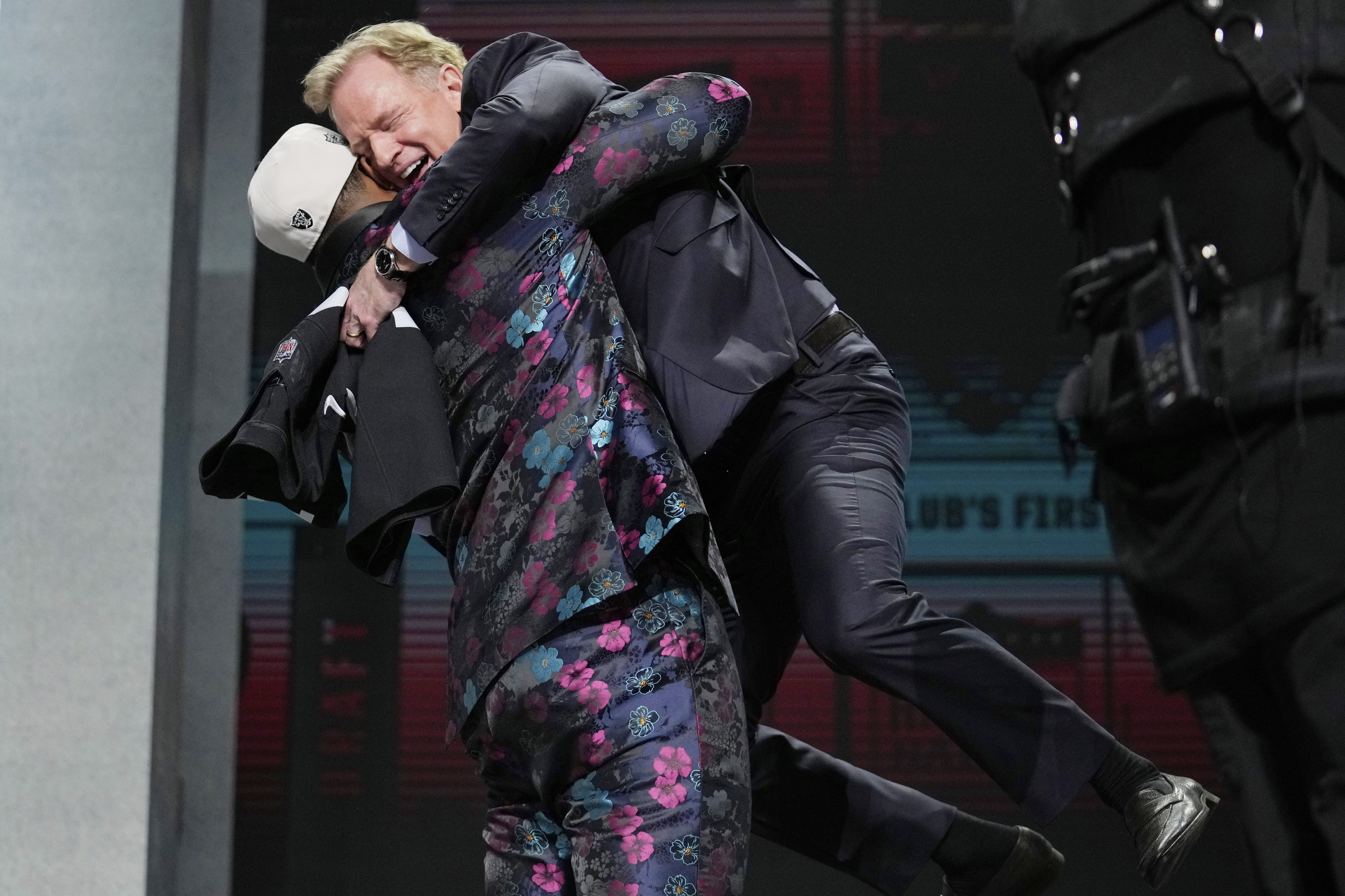 FILE - Texas Tech defensive lineman Tyree Wilson lifts up NFL Commissioner Roger Goodell after being chosen by the Las Vegas Raiders with the seventh overall pick during the first round of the NFL football draft, Thursday, April 27, 2023, in Kansas City, Mo.