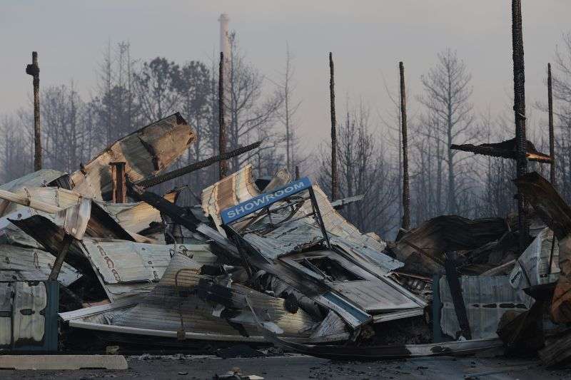 Liberty Door and Awning's 20,000-foot warehouse was damaged by a wildfire in Forked River, N.J., on Wednesday.