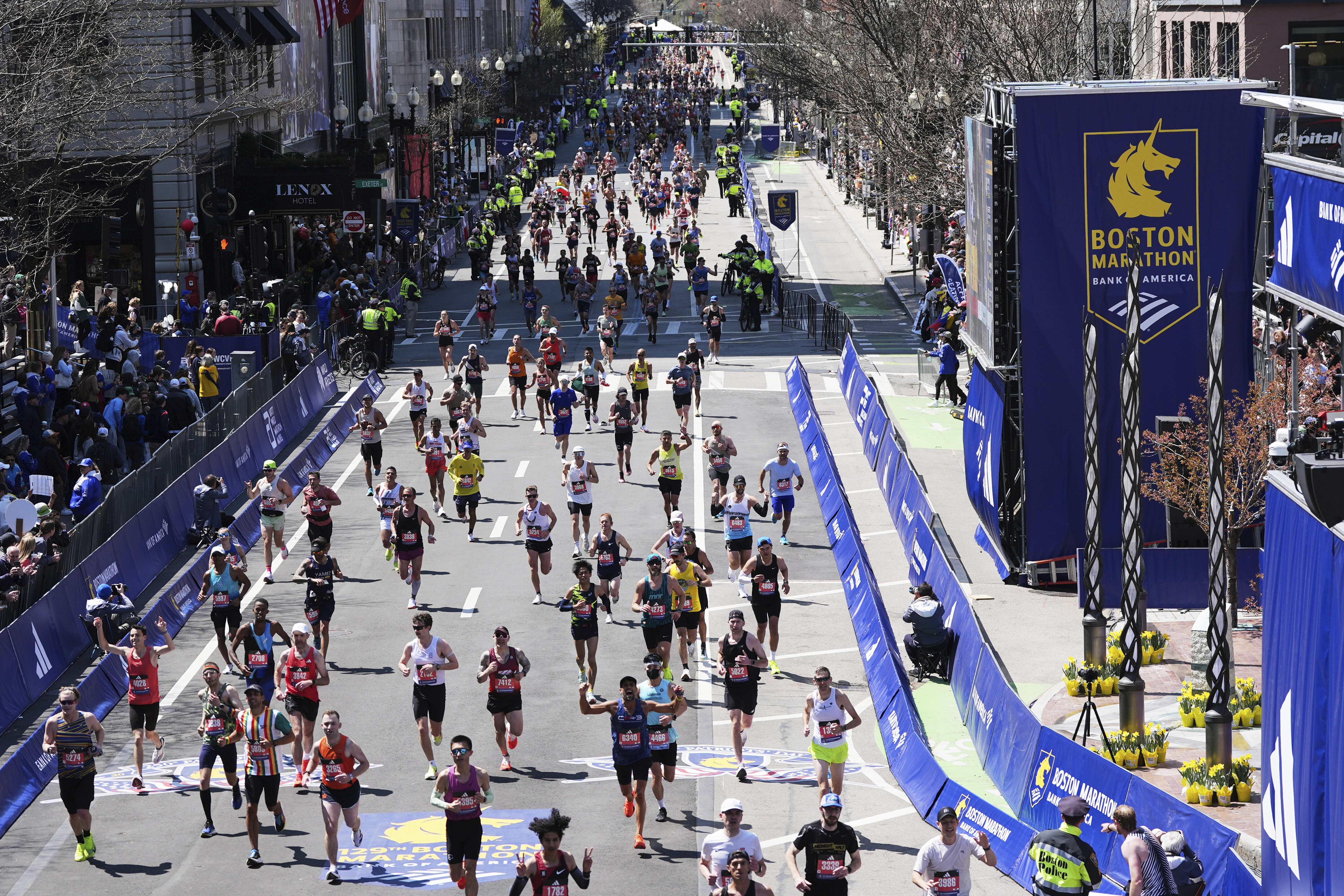 Runners approach the finish line during the Boston Marathon, Monday, in Boston.