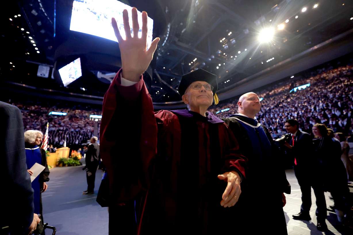 President Dallin H. Oaks, first counselor in the First Presidency of The Church of Jesus Christ of Latter-day Saints, waves to the crowd during Brigham Young University’s commencement ceremony, held at the Marriott Center in Provo on Thursday, April 24.