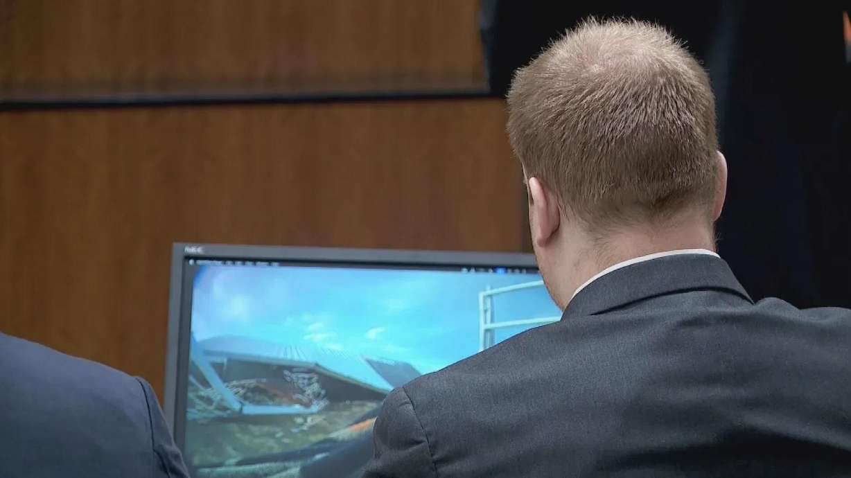 Kent Cody Barlow looks at a screen showing fallen horse corrals as witnesses testify at his jury trial. He is charged with two counts of murder and accused of causing the deaths of two 3-year-old boys in Eagle Mountain.