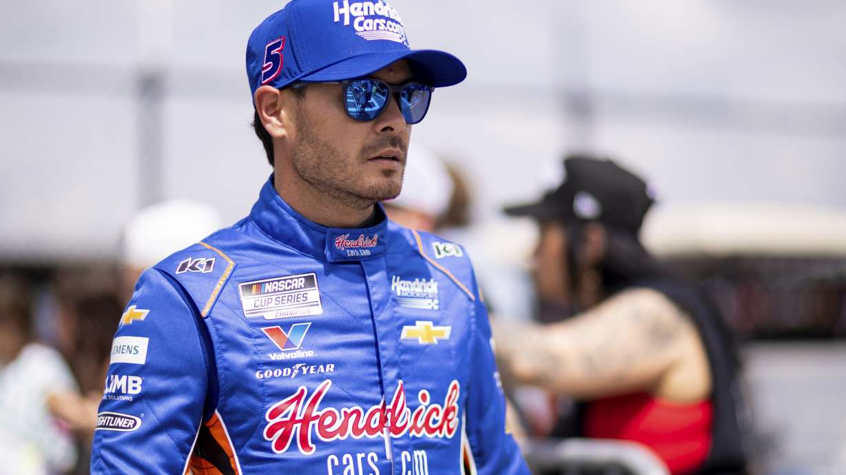Driver Kyle Larson heads to the track before a NASCAR Cup Series auto race at Darlington Raceway, Sunday, April 6, 2025, in Darlington, S.C.