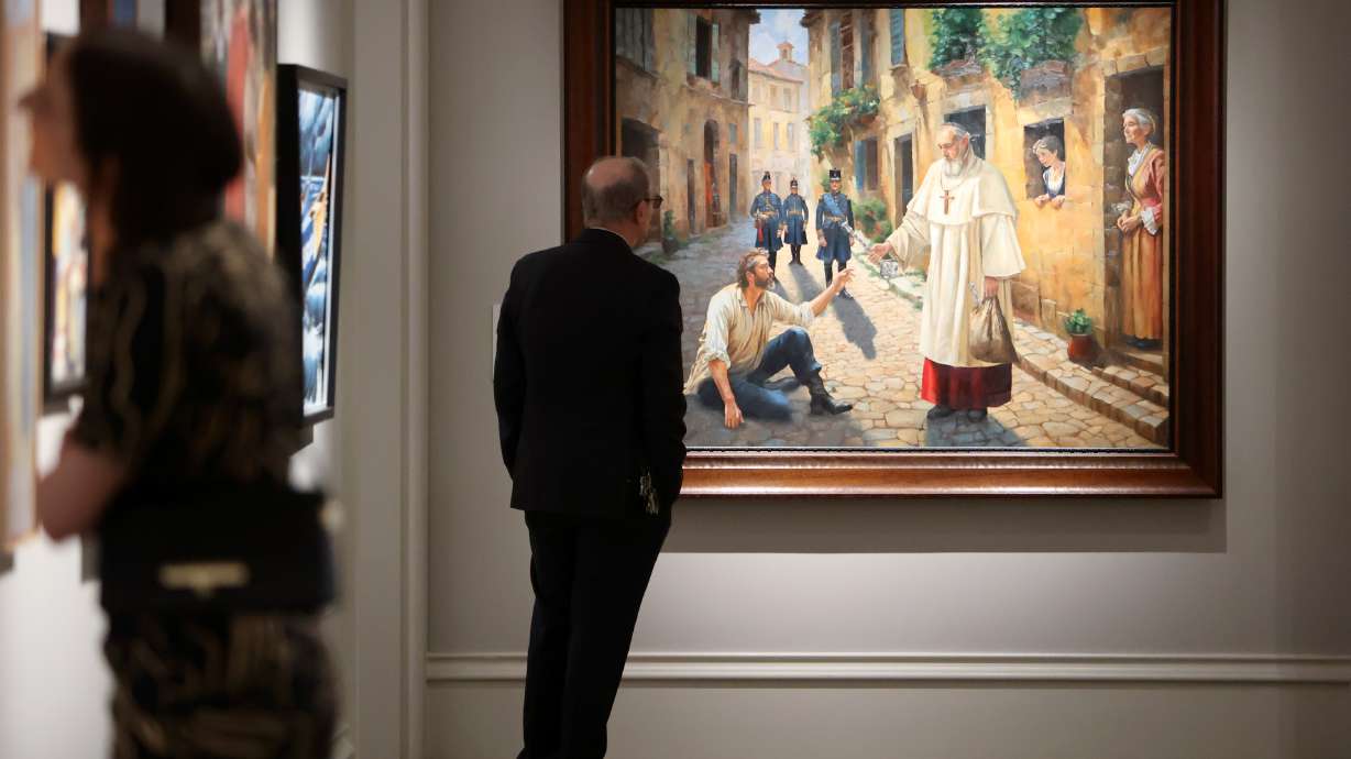 Patrons view art in the “Lift Up the Hands Which Hang Down,” the 13th International Art Competition of The Church of Jesus Christ of Latter-day Saints, at the Church History Museum in Salt Lake City on Thursday.