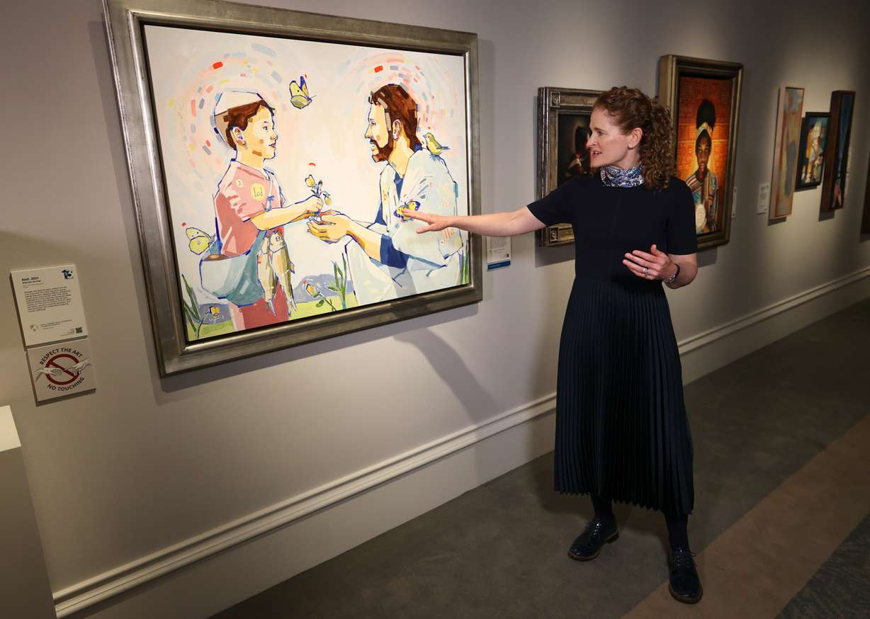 Artist Linda Vance Etherington talks about her piece, “How Many Loaves Have Ye? Bring Them Hither to Me,” at “Lift Up the Hands Which Hang Down,” the 13th International Art Competition of The Church of Jesus Christ of Latter-day Saints, at the Church History Museum in Salt Lake City on Thursday.