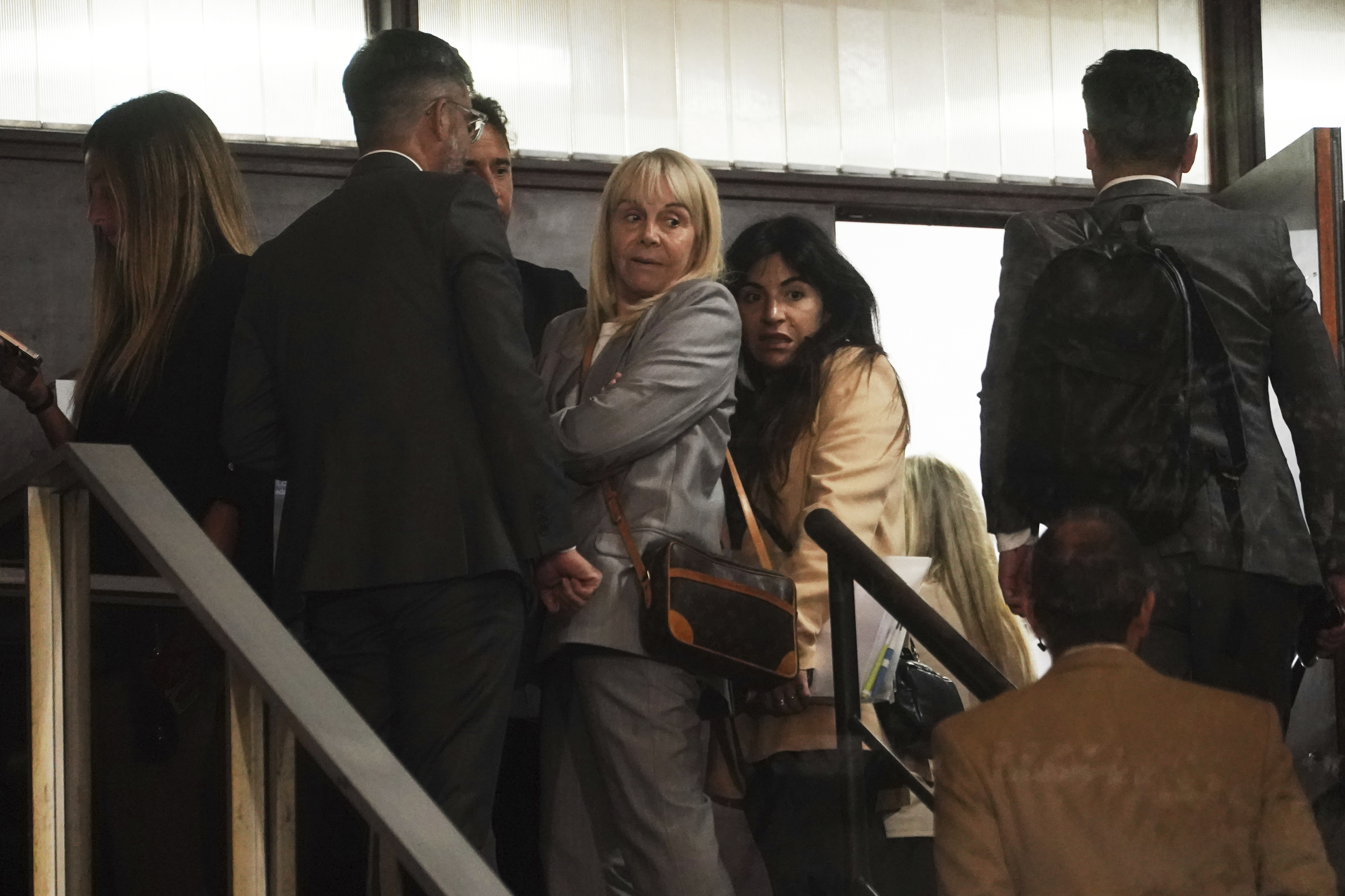Gianinna Maradona, center right, daughter of the late soccer star Diego Maradona, and her mother Claudia Villafane, wait to enter the courtroom in San Isidro, on the outskirts of Buenos Aires, Argentina, Tuesday, April 15, 2025, for a trial over allegations of homicide by negligence against the medical team that treated Diego Maradona.