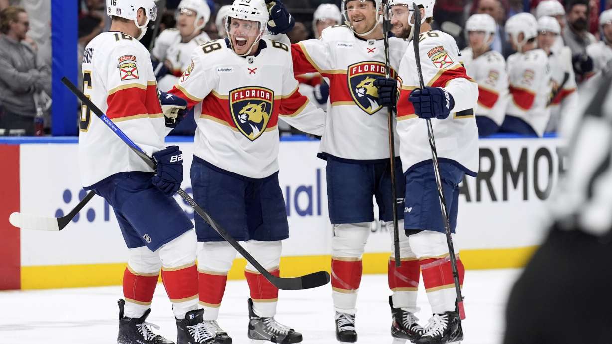 Florida Panthers defenseman Nate Schmidt (88) celebrates his goal against the Tampa Bay Lightning with center Aleksander Barkov (16), Sam Reinhart (13) and Uvis Balinskis (26) during the first period in Game 2 of an NHL hockey Stanley Cup first-round playoff series, Thursday, April 24, 2025, in Tampa, Fla.