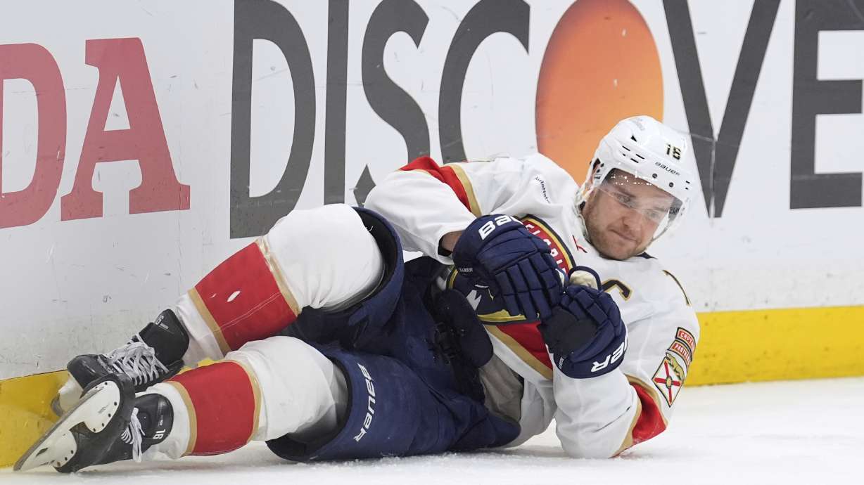Florida Panthers center Aleksander Barkov tries to get up after getting knocked down by Tampa Bay Lightning left wing Brandon Hagel during the third period in Game 2 of an NHL hockey Stanley Cup first-round playoff series, Thursday, April 24, 2025, in Tampa, Fla.