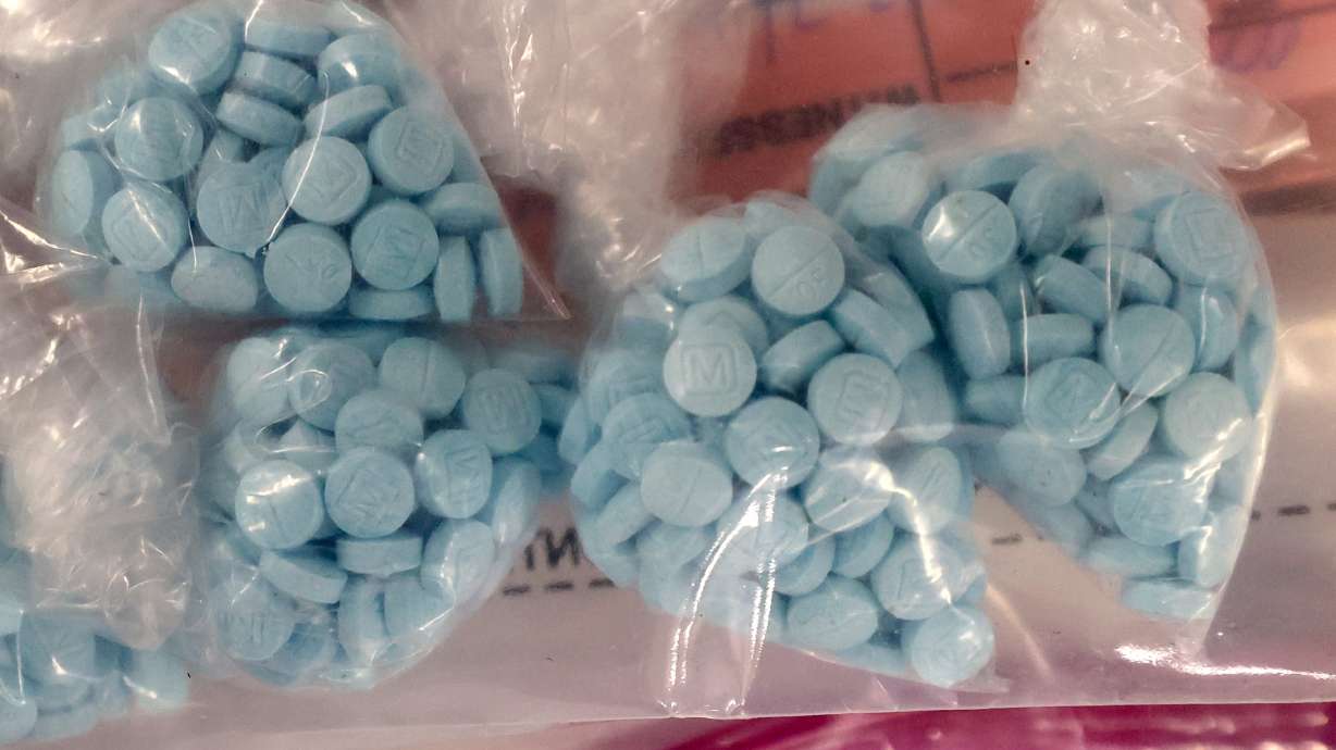 Seized fentanyl pills are displayed during a press conference about the dangers and increase in fentanyl at the Drug Enforcement Administration Salt Lake City District Office in Salt Lake City on July 25, 2024. A man twice-removed from the US was charged this week with drug trafficking and immigration crimes.