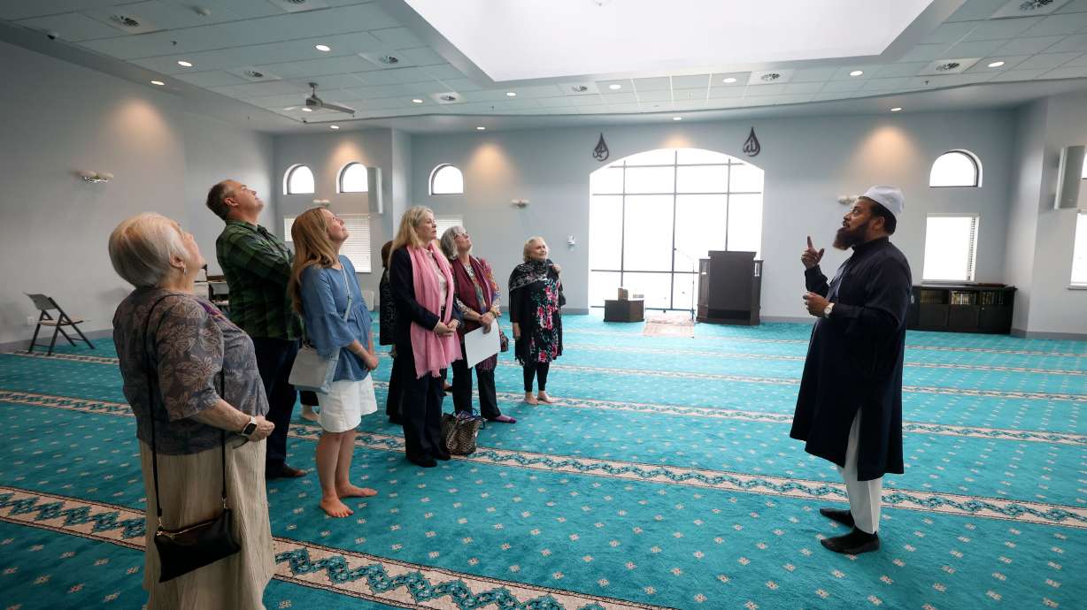 Utah Islamic Center Imam Shuaib Din, right, gives a tour to Salt Lake Interfaith Roundtable members at the Islamic Center in West Jordan on Wednesday.