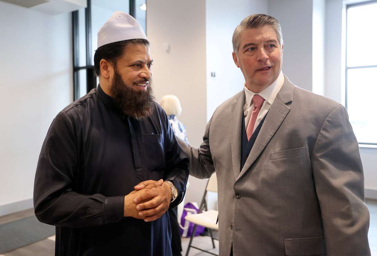 Utah Islamic Center Imam Shuaib Din and the Rev. Curtis Price, pastor of First Baptist Church of Salt Lake City, talk after a Salt Lake Interfaith Roundtable luncheon at the Islamic Center in West Jordan on Wednesday.