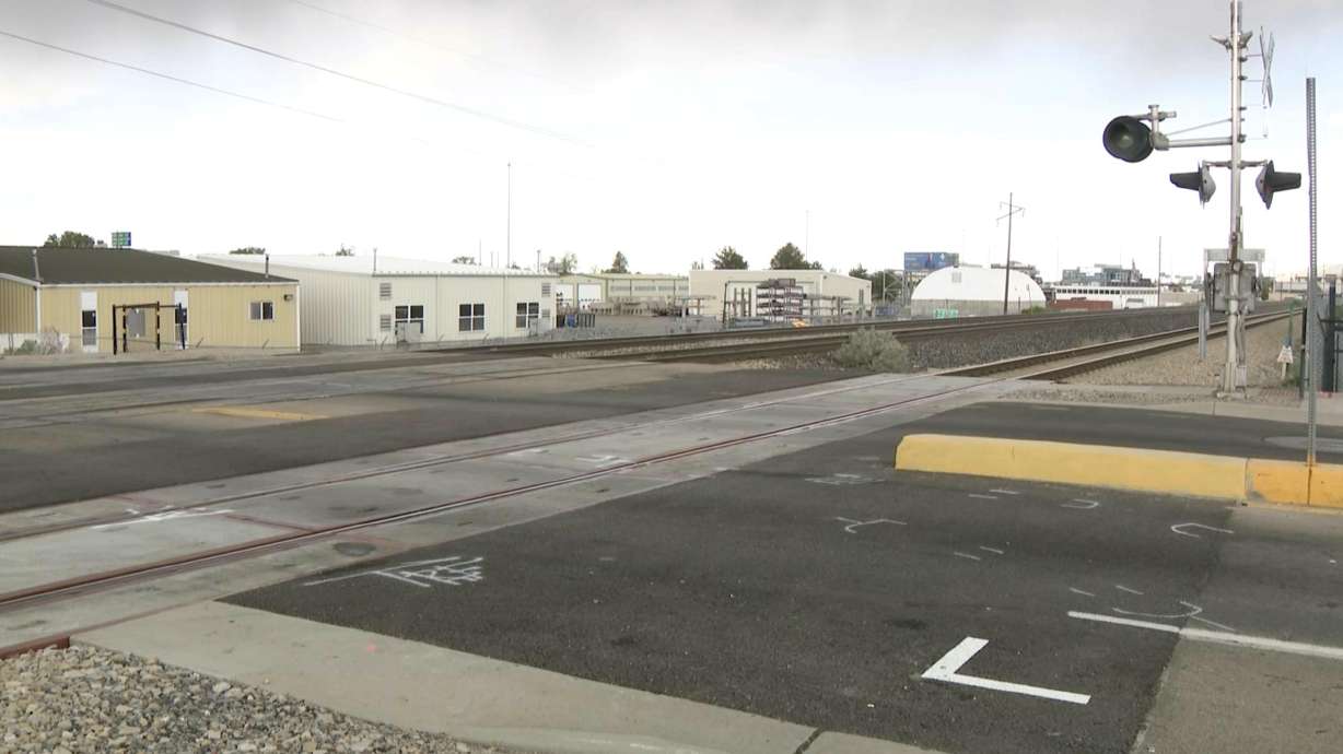 A motorist who allegedly injured two UTA workers in a crash at the 5900 South rail crossing, near 350 West in Murray, has been arrested and jailed on suspicion of fleeing the scene of an accident.