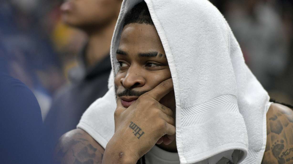 Memphis Grizzlies guard Ja Morant looks on from the bench in the first half of Game 3 of an NBA first-round playoff series against the Oklahoma City Thunder, Thursday, April 24, 2025, in Memphis, Tenn.