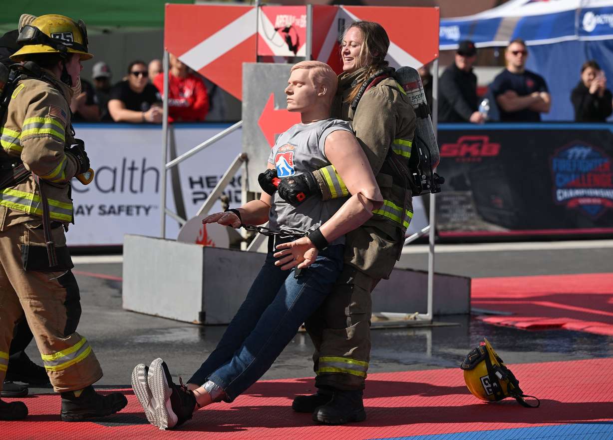 West Valley City Fire’s Nukell Seymour loses her helmet as she pulls a weighted mannequin as she competes in the SERVPRO FCL 2025 West Region Classic in the TFT Firefighter Challenge Championship Series, at the Utah State Fairpark in Salt Lake City on Friday.