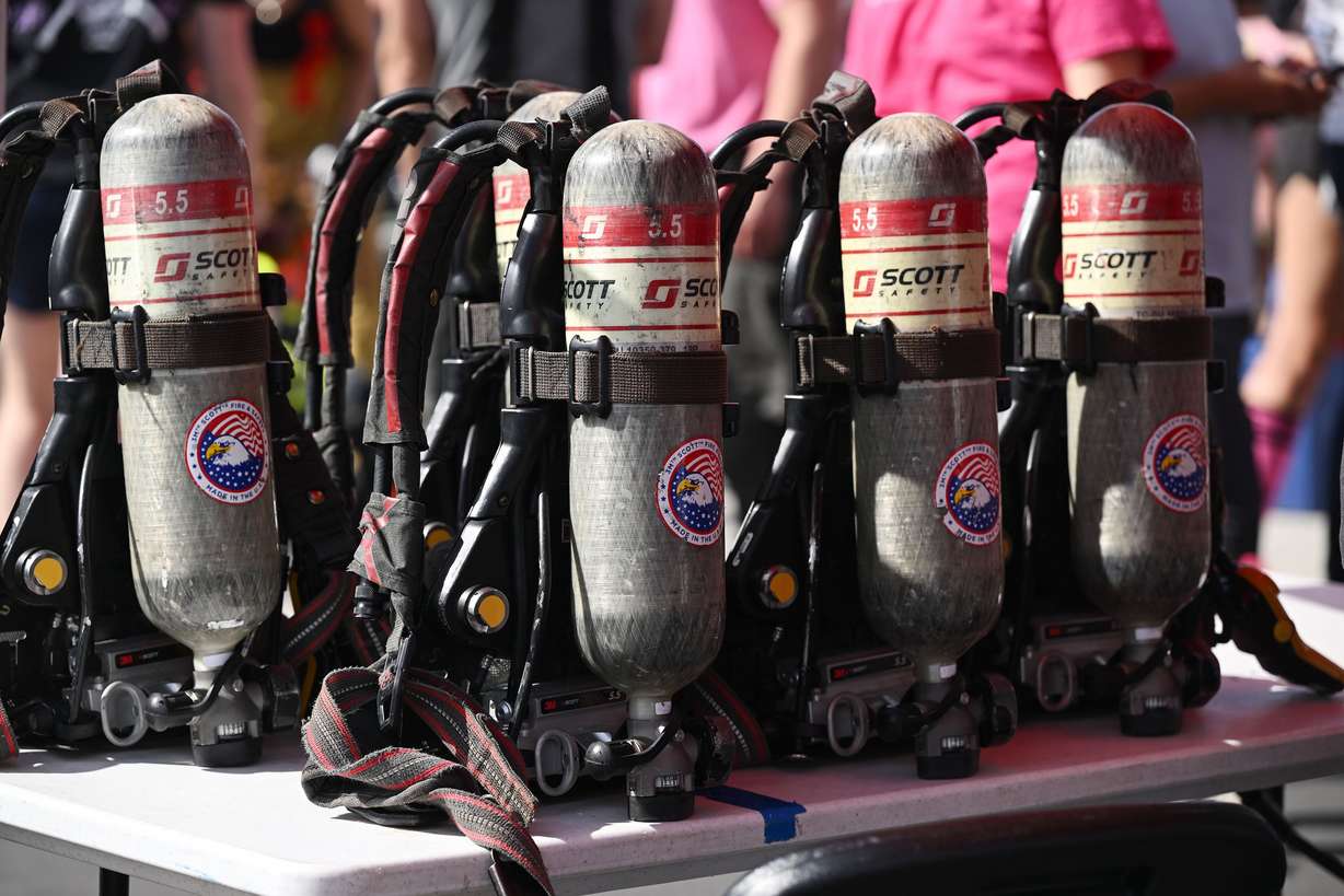 Air tank and gear sit on a table near the start line as firefighters compete in the SERVPRO FCL 2025 West Region Classic in the TFT Firefighter Challenge Championship Series, at the Utah State Fairpark in Salt Lake City on Friday.