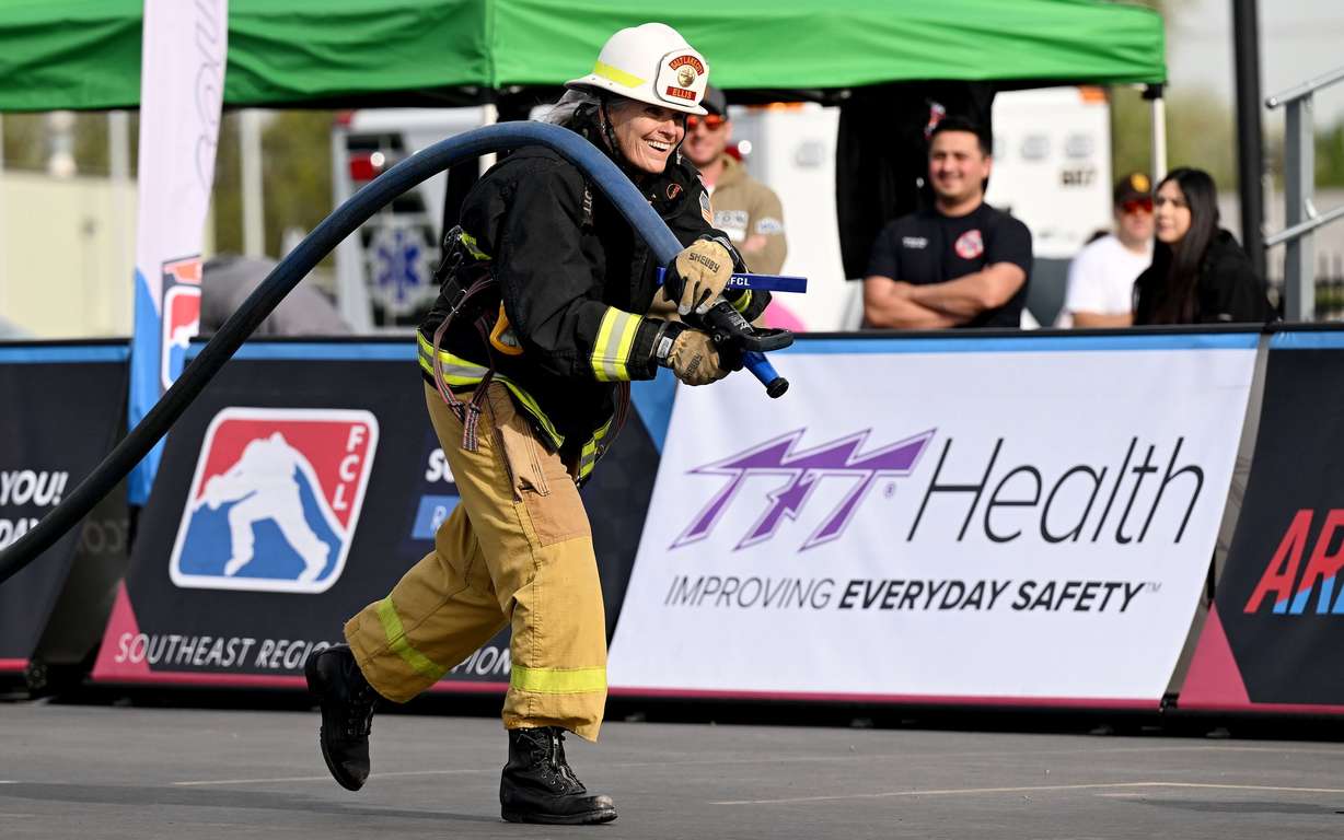 Retired Salt Lake City firefighter Martha Ellis pulls a fire hose during the SERVPRO FCL 2025 West Region Classic in the TFT Firefighter Challenge Championship Series, at the Utah State Fairpark in Salt Lake City on Friday.