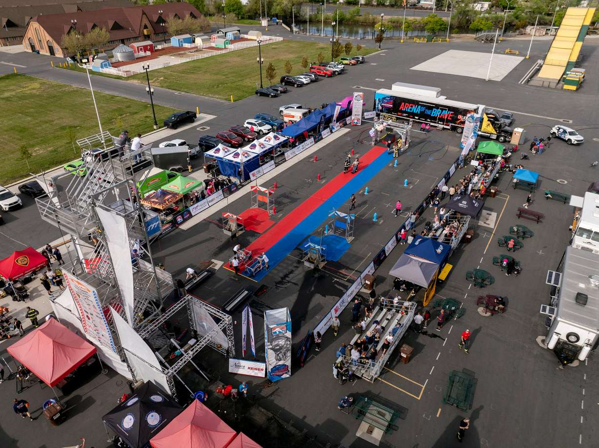 Firefighters compete for time in the SERVPRO FCL 2025 West Region Classic in the TFT Firefighter Challenge Championship Series, at the Utah State Fairpark in Salt Lake City on Friday.