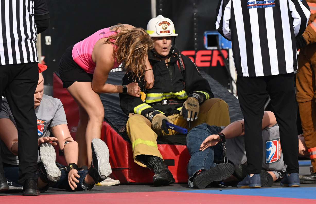Retired Salt Lake City firefighter Martha Ellis breathes heavily after pulling a weighted mannequin during the SERVPRO FCL 2025 West Region Classic in the TFT Firefighter Challenge Championship Series, at the Utah State Fairpark in Salt Lake City on Friday.