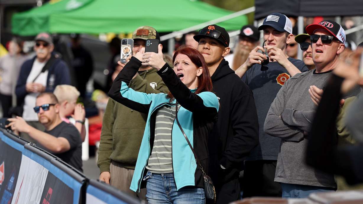 Spectators watch and cheer as they watch firefighters competing in the SERVPRO FCL 2025 West Region Classic in the TFT Firefighter Challenge Championship Series, at the Utah State Fairpark in Salt Lake City on Friday.
