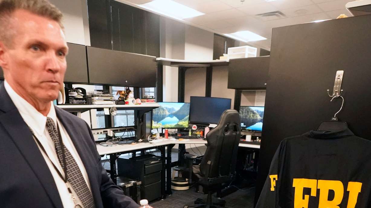 Supervisory special agent Thomas Tedder tours the FBI North Texas Regional Computer Forensics Laboratory, May 11, 2021, in Dallas. The FBI announced a global operation to combat international sextortion schemes on Thursday.