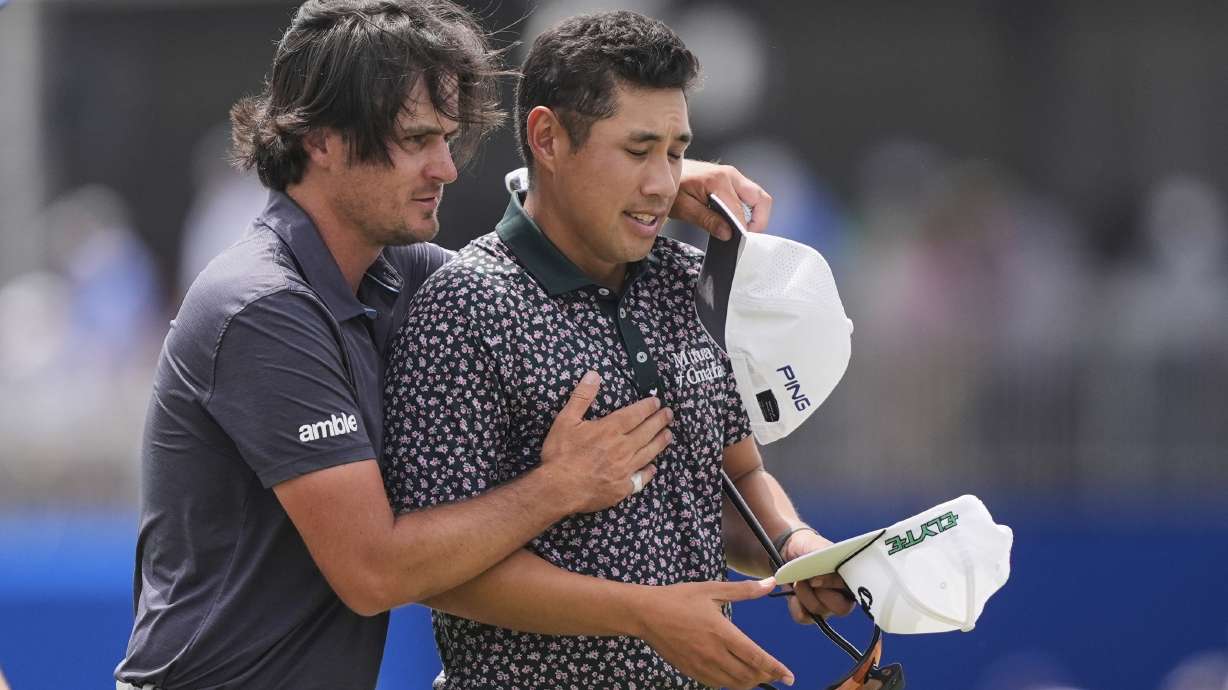 Kevin Velo, left, greets teammate Isaiah Salinda after they set a course record since the current team format was instituted in 2017, during the first round of the PGA Zurich Classic golf tournament at TPC Louisiana in Avondale, La., Thursday, April 24, 2025.