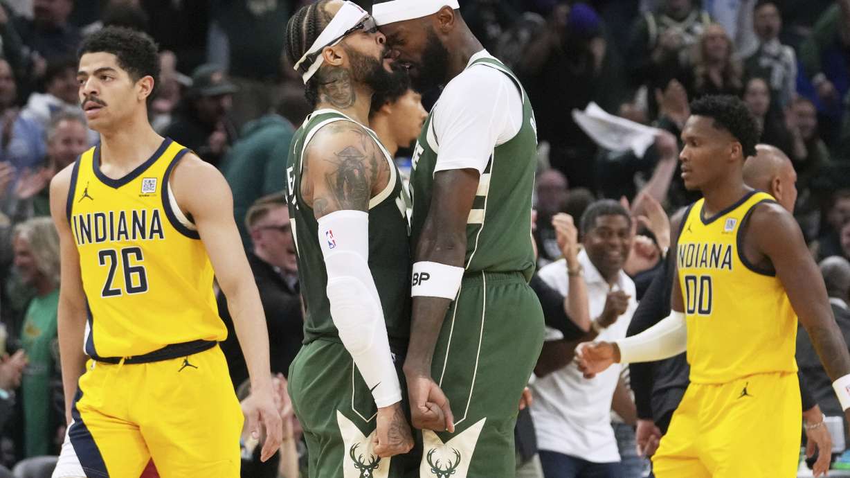 Milwaukee Bucks guard Gary Trent Jr., second from left, celebrates with forward Bobby Portis after scoring a three-point basket during the second half in Game 3 of an NBA basketball first-round playoff series against the Indiana Pacers, Friday, April 25, 2025, in Milwaukee.