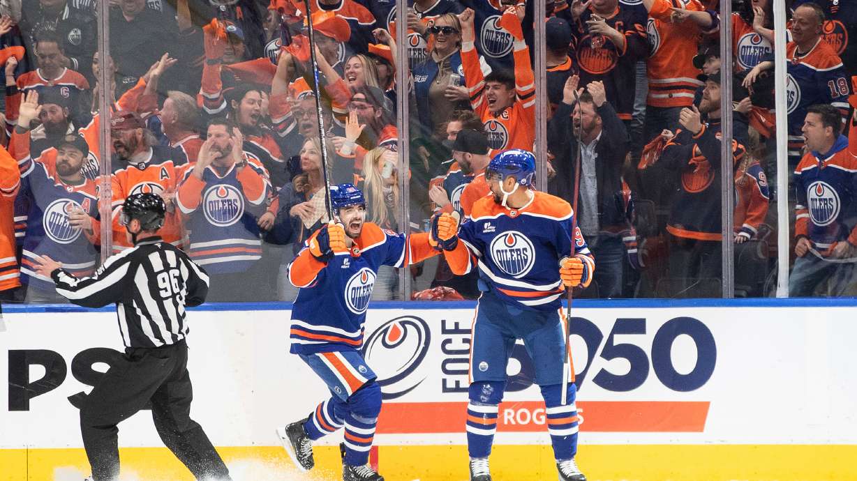 Edmonton Oilers' Jake Walman (96) and Evander Kane (91) celebrate a goal against the Los Angeles Kings during the third period of an NHL hockey playoff game in Edmonton, Alberta, Friday, April 25, 2025.