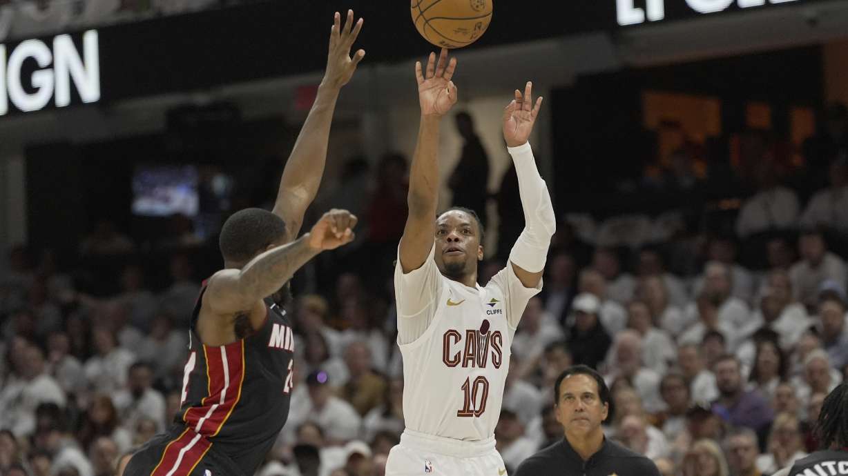 Cleveland Cavaliers guard Darius Garland (10) shoots as Miami Heat forward Haywood Highsmith, left, defends in the second half in Game 2 of an NBA first-round playoff series, Wednesday, April 23, 2025, in Cleveland.