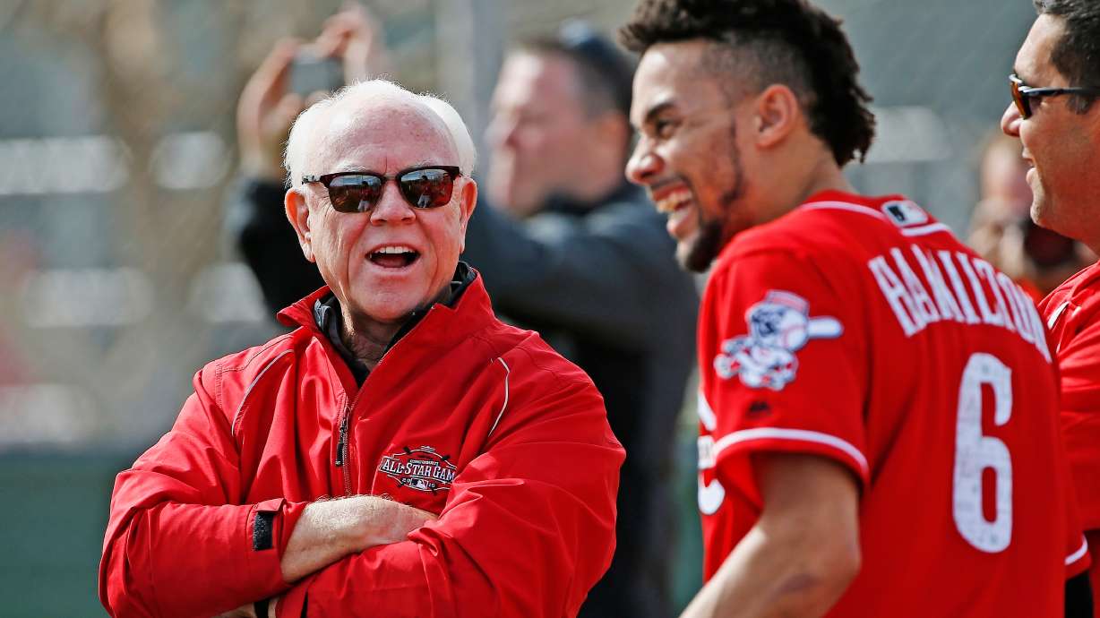FILE - Cincinnati Reds' Billy Hamilton (9) shares a laugh with Reds executive advisor Walt Jocketty, left, at the Reds' baseball spring training facility Friday, Feb. 17, 2017, in Goodyear, Ariz.