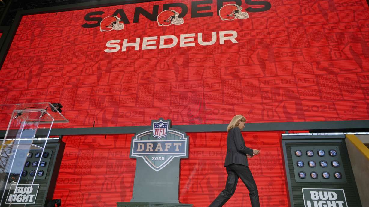 A screen shows Colorado quarterback Shedeur Sanders after being chosen by the Cleveland Browns with the 144th overall pick during the third day of the NFL football draft, Saturday, April 26, 2025, in Green Bay, Wis.