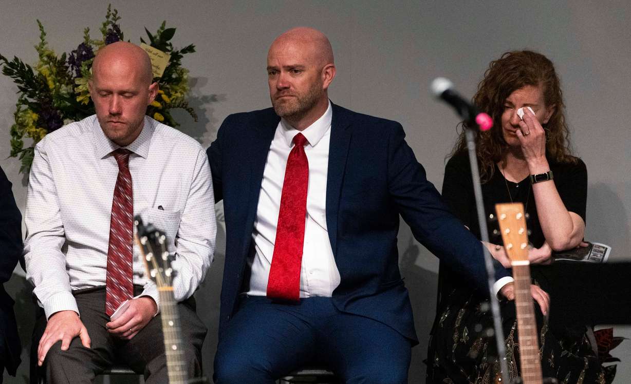 Jerome Summers, center, comforts his siblings, Danica Nebeker, right, and Jordan Summers during a funeral service for their brother, South Jordan firefighter Corban Summers, at Hunter High School in West Valley City on Saturday.
