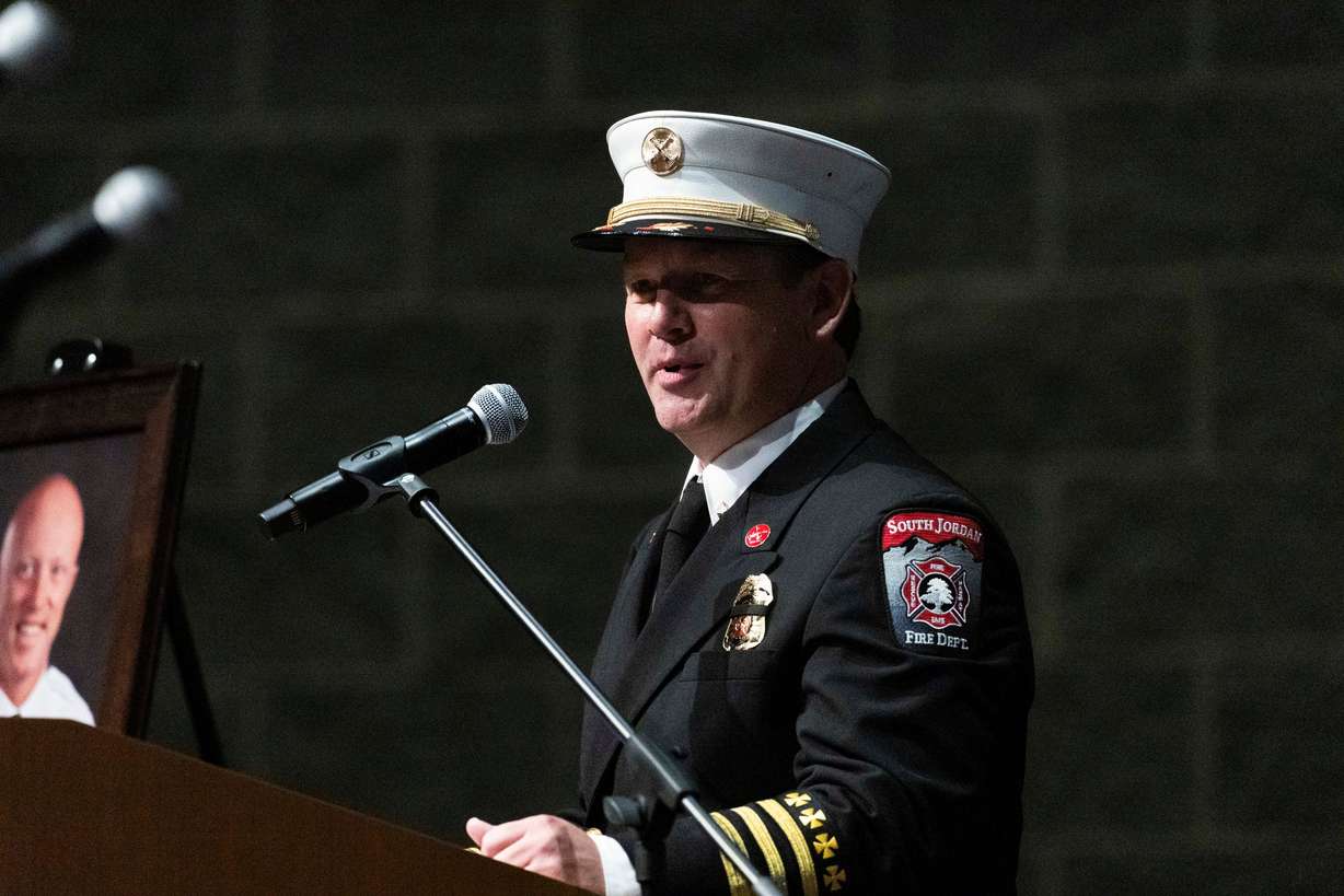 South Jordan Fire Department Battalion Chief Clayton Miller speaks during a funeral service for South Jordan firefighter Corban Summers at Hunter High School in West Valley City on Saturday.