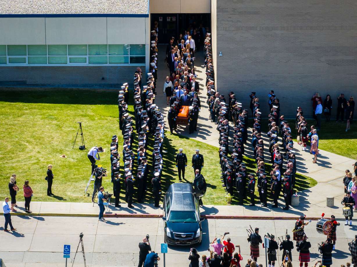 Pallbearers carry the casket of the late South Jordan firefighter Corban Summers toward a hearse after a memorial service held at Hunter High School in West Valley City on Saturday.