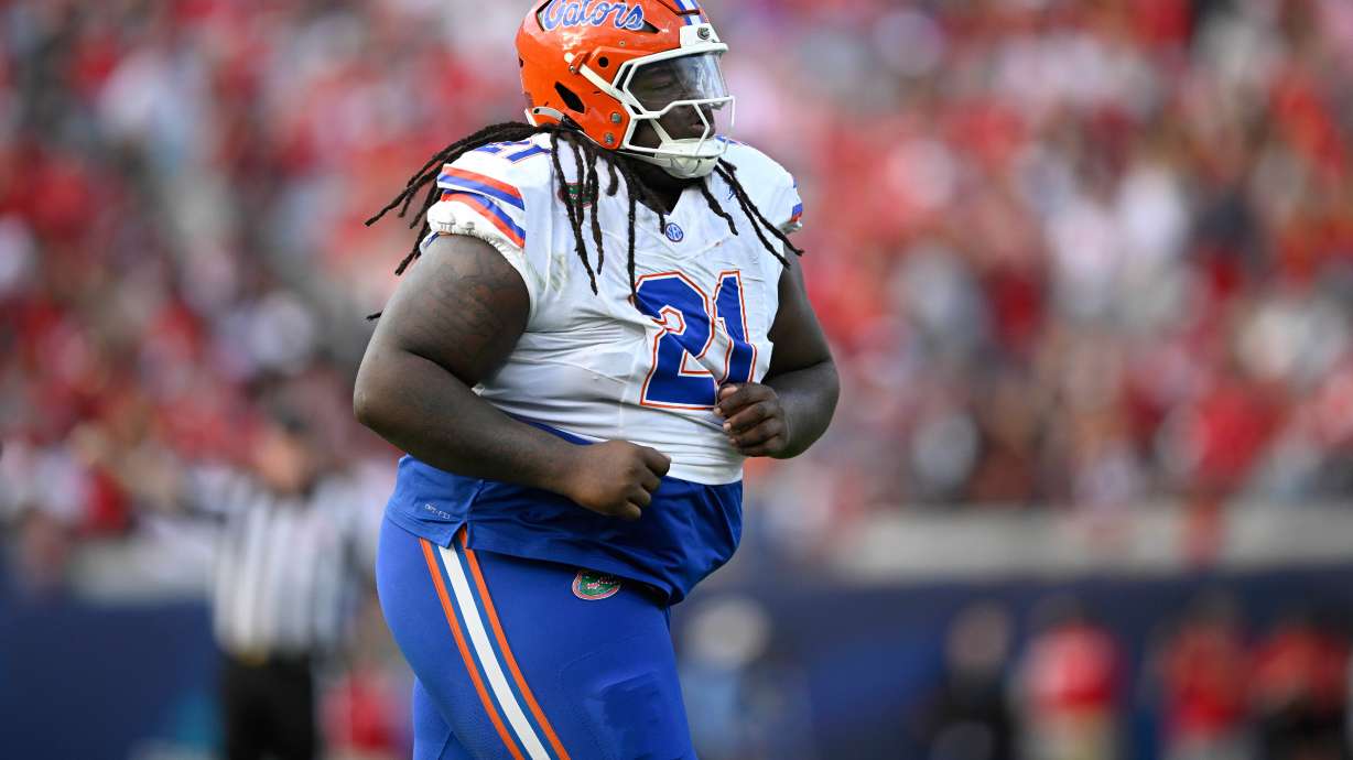 FILE - Florida defensive lineman Desmond Watson (21) runs off the field against Georgia during the first half of an NCAA college football game, Nov. 2, 2024, in Jacksonville, Fla.