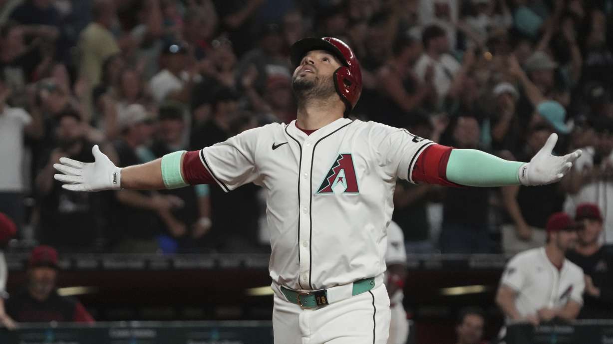 Arizona Diamondbacks' Eugenio Suárez reacts after hitting a solo home run and fourth of the game against the Atlanta Braves in the ninth inning during a baseball game, Saturday, April 26, 2025, in Phoenix.
