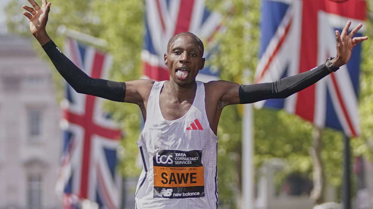 Sabastian Sawe of Kenya reacts after he crossed the line to win the men's race at the London Marathon, Sunday, April 27, 2025.