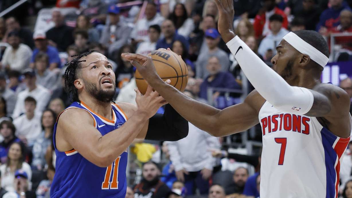 New York Knicks guard Jalen Brunson (11) takes a shot against Detroit Pistons forward Paul Reed during the first half of Game 4 of an NBA basketball first-round playoff series Sunday, April 27, 2025, in Detroit.