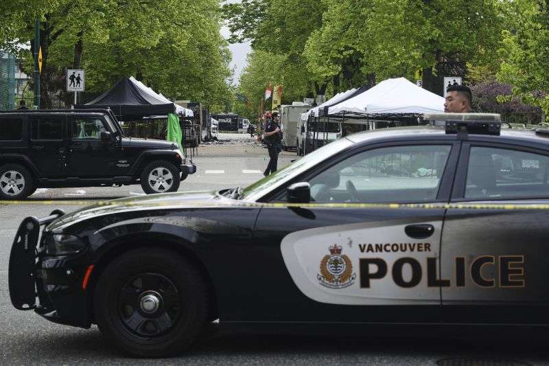 Vancouver Police survey the scene after a driver killed multiple people Saturday during a Filipino community festival Sunday in Vancouver, Canada.