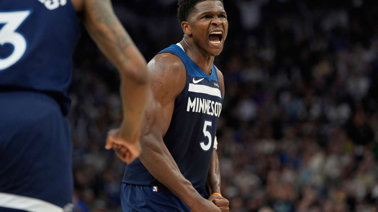 Minnesota Timberwolves guard Anthony Edwards (5) celebrates after a shot made by forward Julius Randle (30) during the first half of Game 4 of an NBA basketball first-round playoff series against the Los Angeles Lakers, Sunday, April 27, 2025, in Minneapolis.