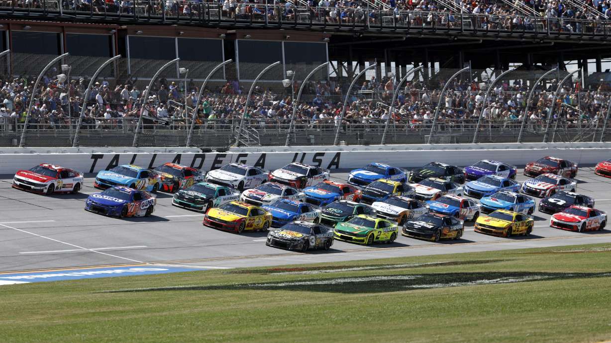 Drivers race four wide during a NASCAR Cup Series auto race at Talladega Superspeedway, Sunday, April 27, 2025, in Talladega, Ala.