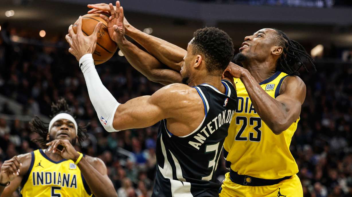 Milwaukee Bucks' Giannis Antetokounmpo (34) grabs a rebound against the Indiana Pacers' Aaron Nesmith during the first half of Game 4 of a first-round NBA basketball playoff series Sunday, April 27, 2025, in Milwaukee.