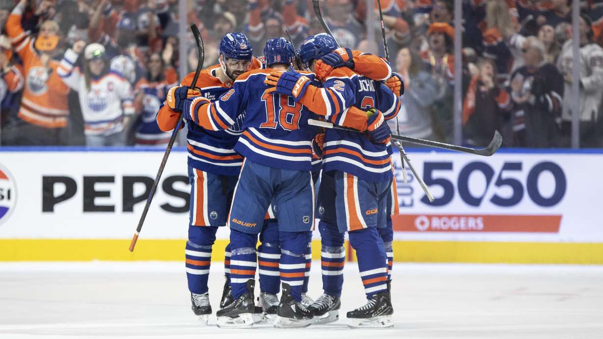 Edmonton Oilers players celebrate a goal against the Los Angeles Kings during the third period of an NHL playoff game in Edmonton on Sunday, April 27, 2025.