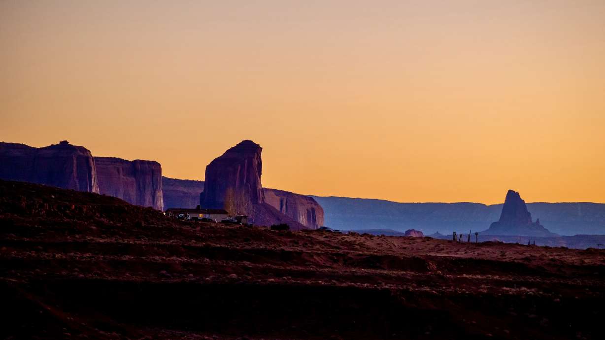 Homes on the Navajo Nation near Monument Valley in Utah are pictured at dusk on Nov. 15, 2022. Navajo Nation and San Juan County leaders have extended an accord that aims to bolster voting access for Navajo residents.
